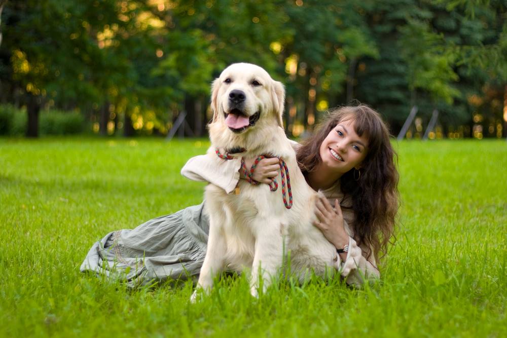 woman hugging a dog